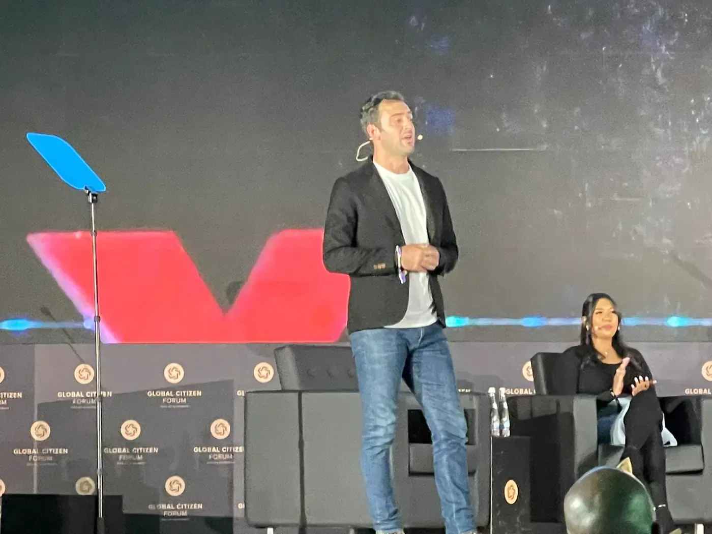 Grant speaking on a TEDx stage